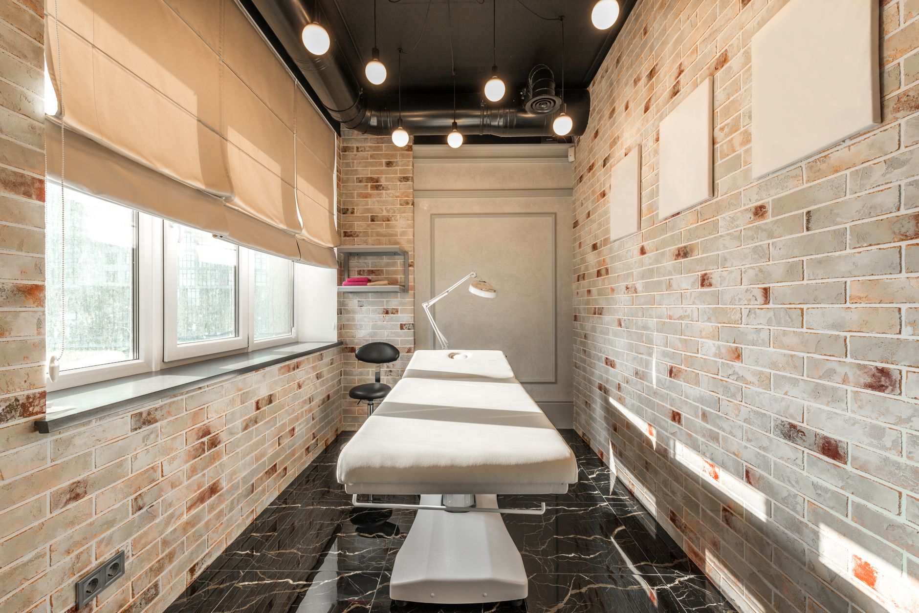Warm, light-filled treatment room of an established aesthetic business